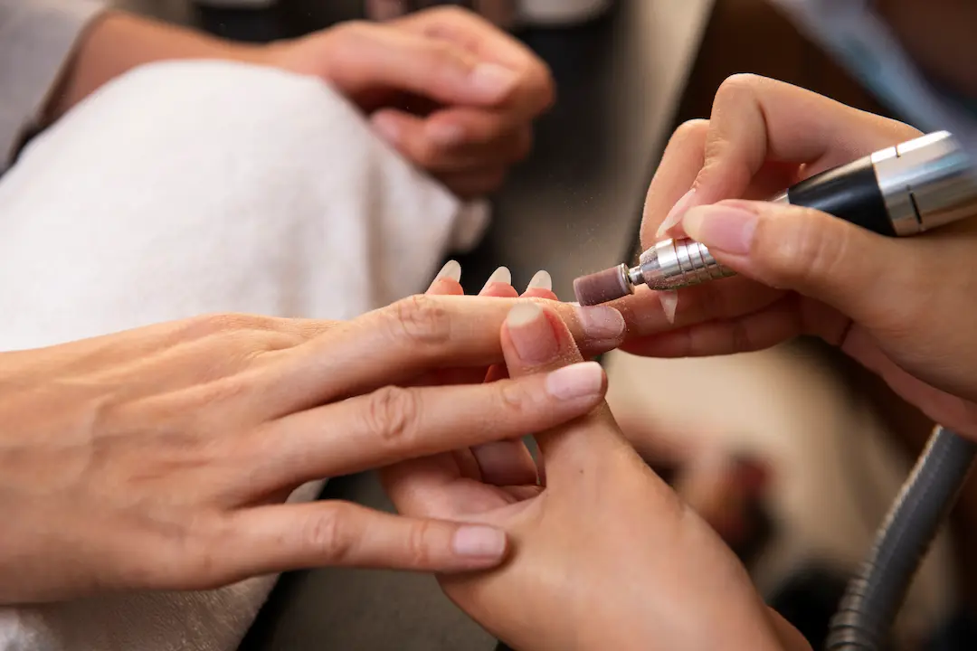 high-angle-woman-getting-manicure